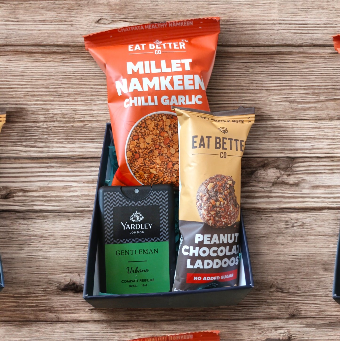Mini hamper with millet namkeen, men's pocket perfume and chocolate peanut laddoo