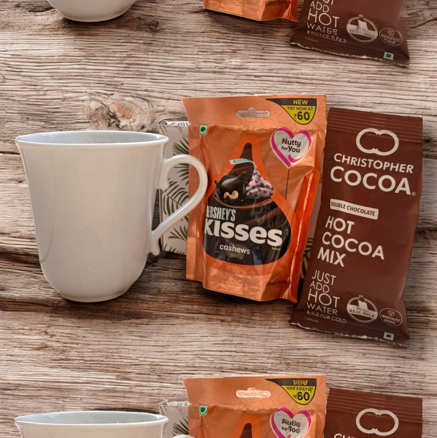 Mini gift hamper box with an elegant coffee mug, pack of hot cocoa and a pack of Hershey's kisses
